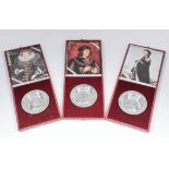 A set of six Elizabeth II silver "Royal Lineage" circular dishes, the centre of each with a