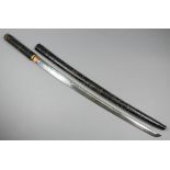 A Japanese sword in the Shikomizue style, 28ins katana style blade, bearing slight visible Hammon,