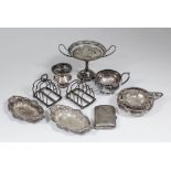 A pair of George V silver rectangular four division toast racks, each 3.5ins x 2.375ins, by