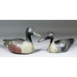 A wooden decoy duck naturalistically painted in shades of brown, green and greys, 14ins x 7ins high,