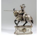 A good late 19th/early 20th Century German silver model of a medieval Knight in full armour on