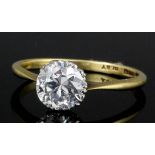 A modern 18ct gold and platinum mounted solitaire ring, the brilliant cut stone approximately 1.