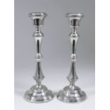 A pair of Elizabeth II silver pillar candlesticks, the tapered stems with bulbous reeded knops and