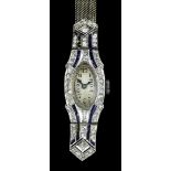 A 1920s lady's platinum, sapphire and diamond set wristwatch, the silver oval face with Arabic