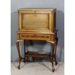 An Edwardian mahogany Secretaire cabinet inlaid with satinwood bandings, the upper part with lifting