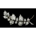 A late Victorian gold and silvery coloured metal mounted all diamond set leaf pattern brooch, the