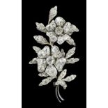 A late Victorian gold and silvery coloured metal mounted all diamond set floral spray brooch, the