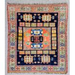 A modern Turkish rug of Kazak design woven in colours with three central octagonal motifs and