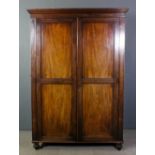 19th Century mahogany wardrobe, with moulded cornice, fitted hanging compartment and three small