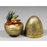An Elizabeth II silver gilt "Mystery Easter Egg" opening to reveal various seashells including a
