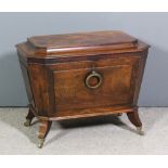 A George IV mahogany octagonal wine cooler of sarcophagus shape with deep moulded edge to lid