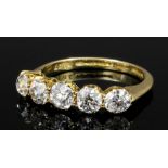 An Edwardian 18ct gold mounted five stone diamond ring, the old cut stones each approximately .