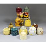 A small collection of ceramic honey pots and bee related items, including - two Continental oil