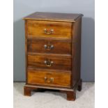 A mahogany bedside chest of Georgian design fitted four drawers, on bracket feet, 18.5ins wide x