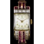 A 1960s lady's 9ct rose gold, ruby and diamond set Nidor cocktail watch, the white face with gilt