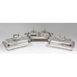 A pair of plated rectangular entree dishes and covers with gadroon mounts and handles cast with leaf