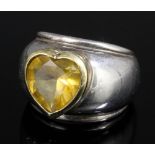 A modern Tiffany 18ct gold and silver mounted citrine set ring, the wide silver band set to the