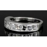 A modern silvery coloured metal mounted all diamonds set half hoop eternity ring, the face set