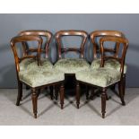 A set of five early Victorian mahogany dining chairs, with plain crest rails scroll carved splats,