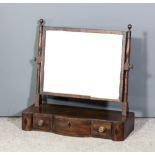 A 19th Century mahogany framed rectangular toilet mirror inlaid with ebonised stringings, on