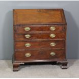 A George III mahogany bureau, the slope enclosing fitted interior with six small drawers, central