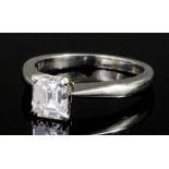 A modern platinum mounted diamond solitaire ring by David Morris,the emerald cut stone of 1.06ct (