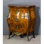 An early 20th Century Austrian walnut and marquetry commode of bombe outline with gilt brass mounts,