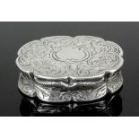 A Victorian silver oval vinaigrette of shaped and moulded outline, the lid and base engraved with