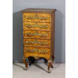 A French walnut and gilt brass mounted petit commode, the top and draw fronts cross banded and