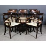 A set of six George III mahogany dining chairs and two additional modern replacement armchairs