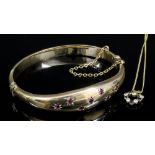 A modern 9ct gold stiff bangle in the "Victorian" manner, "Gypsy" set to the face with seven small