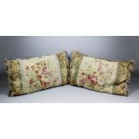 A pair of Aubusson tapestry cushions, the central panels worked with flowers, fringed and braided,