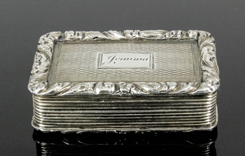 A George IV silver gilt rectangular vinaigrette, the lid and base with cast leaf scroll mounts and