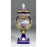 A 19th Century French porcelain vase and cover after a Sevres original, the moulded and jewelled