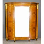 A French satinwood and gilt metal mounted break-front wardrobe, the whole inlaid with bandings and