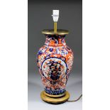 A Japanese Imari baluster - shaped vase converted to an electric table lamp, with fitted wooden