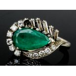 A 1960s silvery coloured metal mounted emerald and diamond ring, the pear shaped emerald