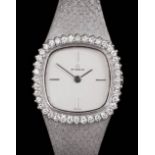 A 1980's lady's 18k white gold Eterna cocktail watch, the silvered face quarter set with baton