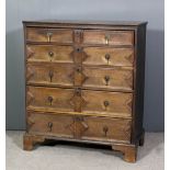 A late 17th/ early 18th Century oak chest of drawers, fitted two short and four long graduated