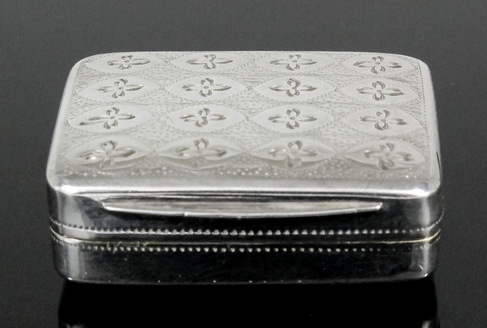 A George III silver rectangular vinaigrette, the lid engraved with sixteen flowerheads, the gilt