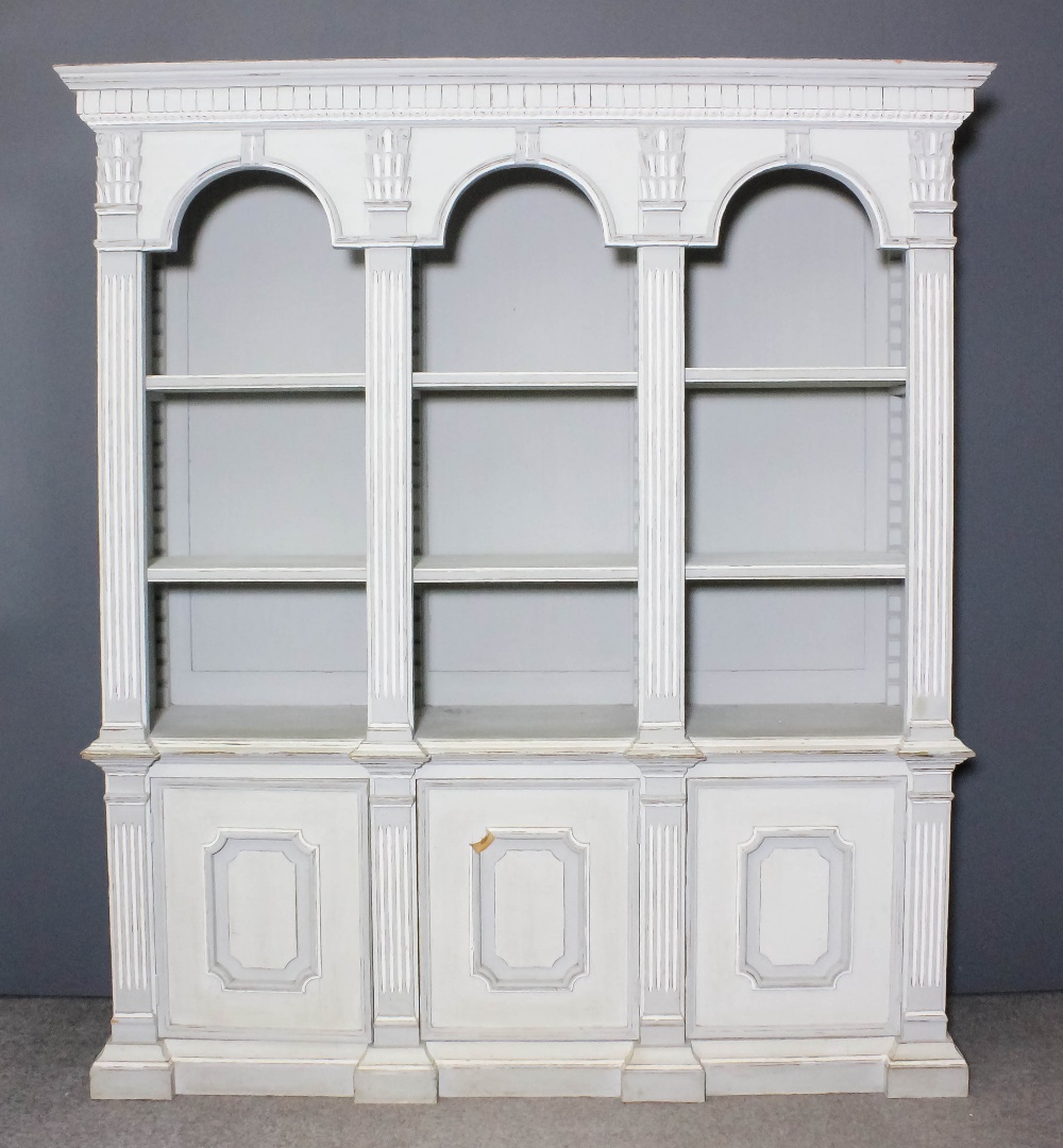 A French pale blue and white painted pine bookcase of neoclassical design, the upper part with
