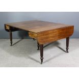 A George IV mahogany dropleaf concertina action extending dining table with two original extra