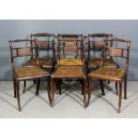 A set of six George IV mahogany dining chairs with rope twist crest rails, cane panelled backs and