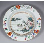 An 18th Century Chinese "Famille Verte" porcelain circular basin enamelled in colours with pavilions