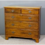 A mahogany chest of drawers of George III design fitted two short and three long drawers with bramah
