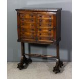 A Victorian rosewood twin specimen cabinet with square edge to top, fitted with two sets each of