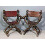 A pair of Victorian carved walnut X pattern folding armchairs of 16th Century Italian design with