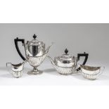 An Edward VII and George V silver Harlequin four piece tea and coffee service of Georgian design