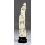 A 20th Century Chinese carved ivory figure of Shou Lao (Chinese God of Longevity), holding a staff