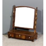 A mahogany framed rectangular toilet mirror with arched top, on slender turned uprights, the bow-